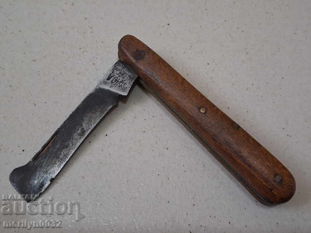 Old vine knife with wooden handles with markings Old vine knife with wooden handles with markings