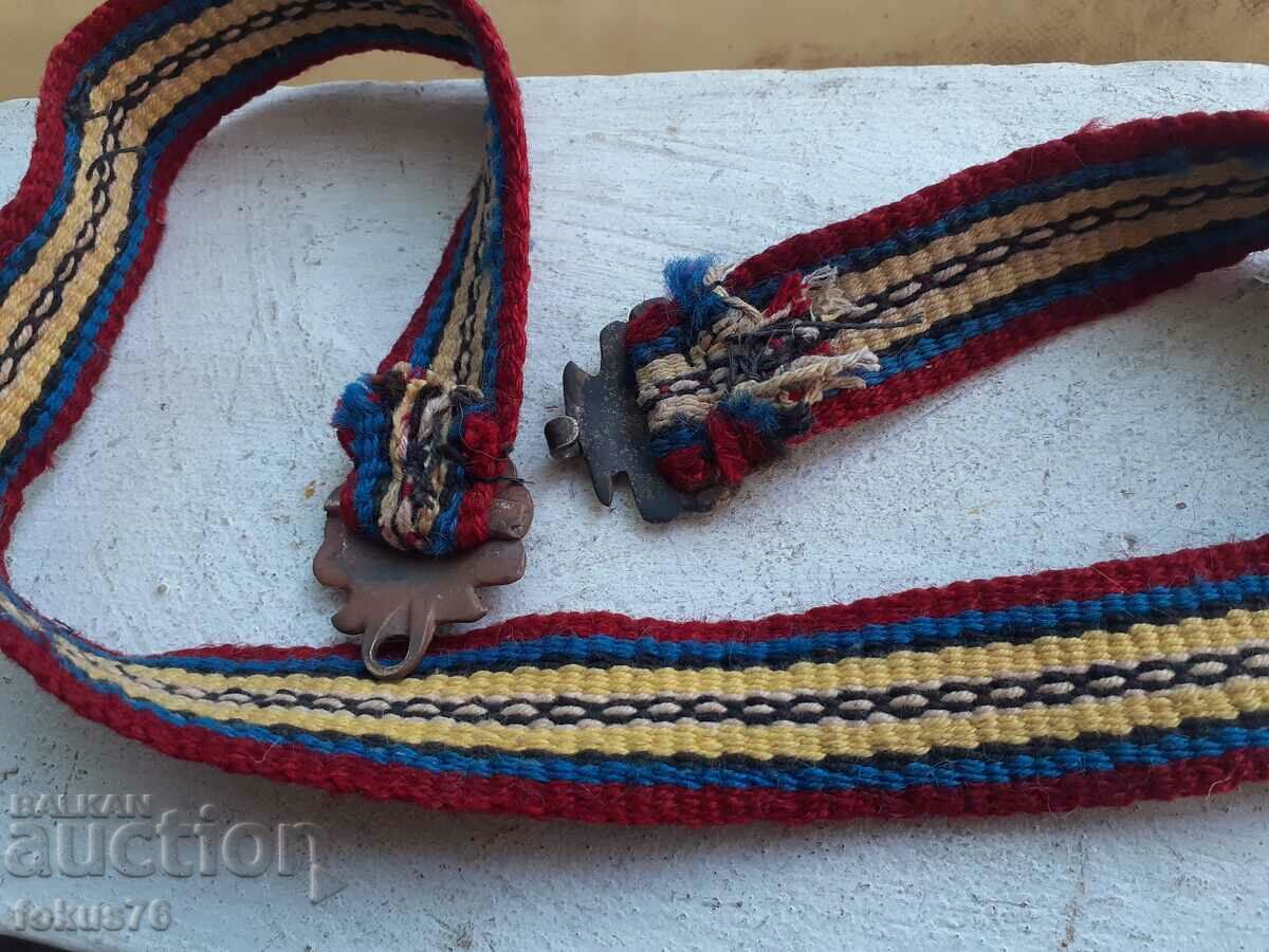 Delivery of Knitted woolen belt with small bronze pofts for costume - children's