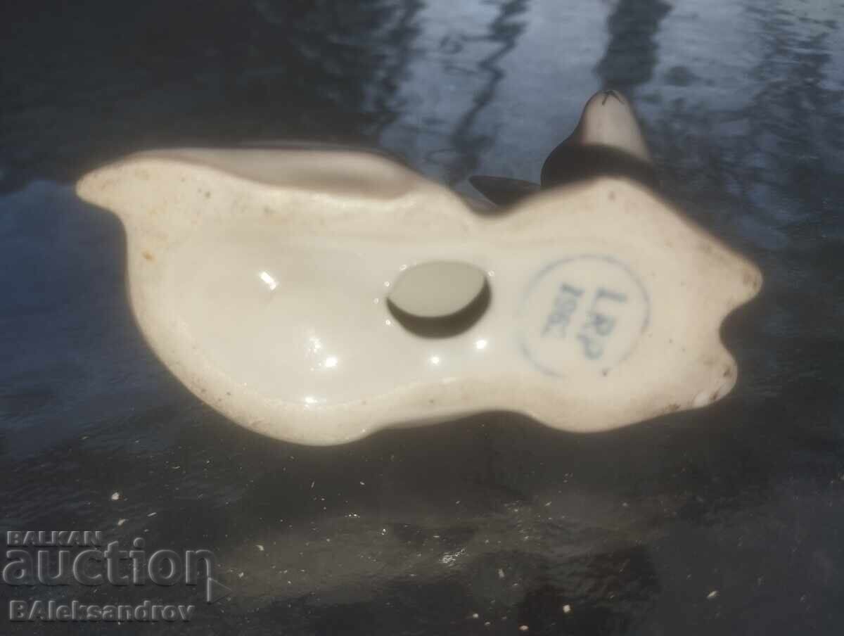 Auction  Porcelain fawn with a marking rod