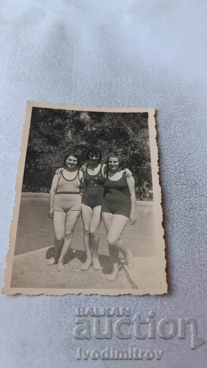 Photo of three young girls in retro swimsuits