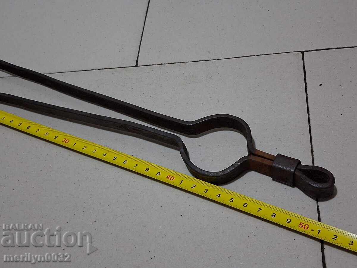 Auction  Old tongs, dilaf, wrought iron
