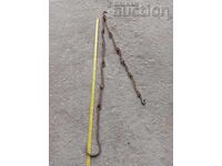 Παλιά σφυρήλατη αλυσίδα με γάντζο για χαλκό χαράνια χαλκό