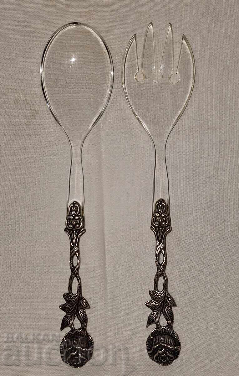 Old cutlery set with silver handles with a rose Old cutlery set with silver handles with a rose