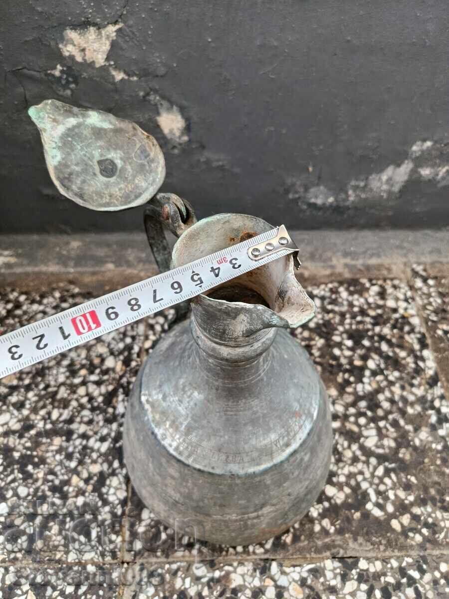 Delivery of Old copper jug with inscriptions Delivery of Old copper jug with inscriptions