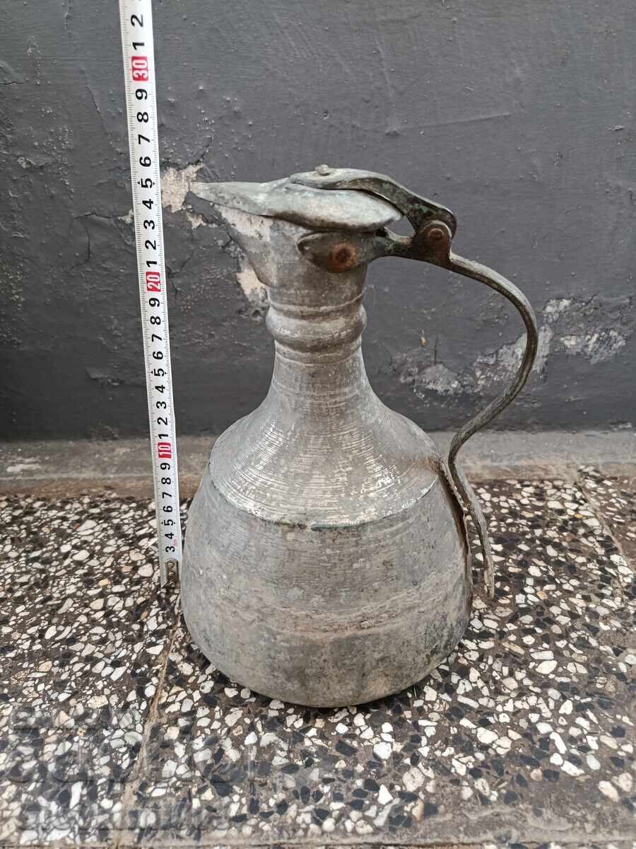 Old copper jug with inscriptions Old copper jug with inscriptions