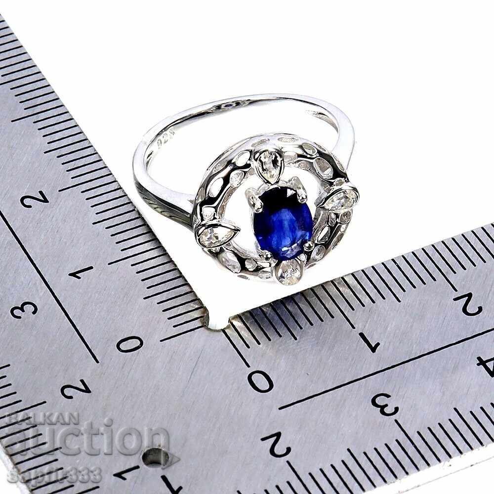 Auction  Designer ring with natural sapphire and white topazes