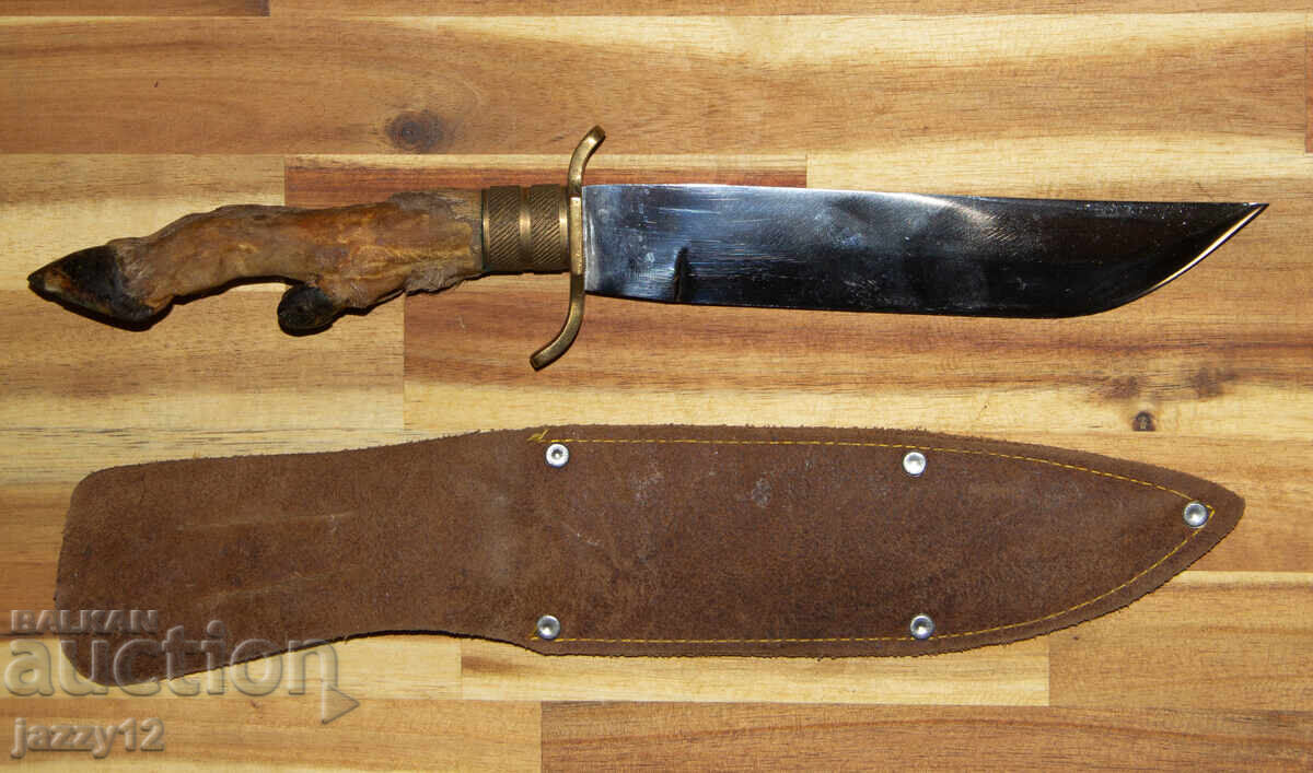 Solid hunting knife with a hoof handle