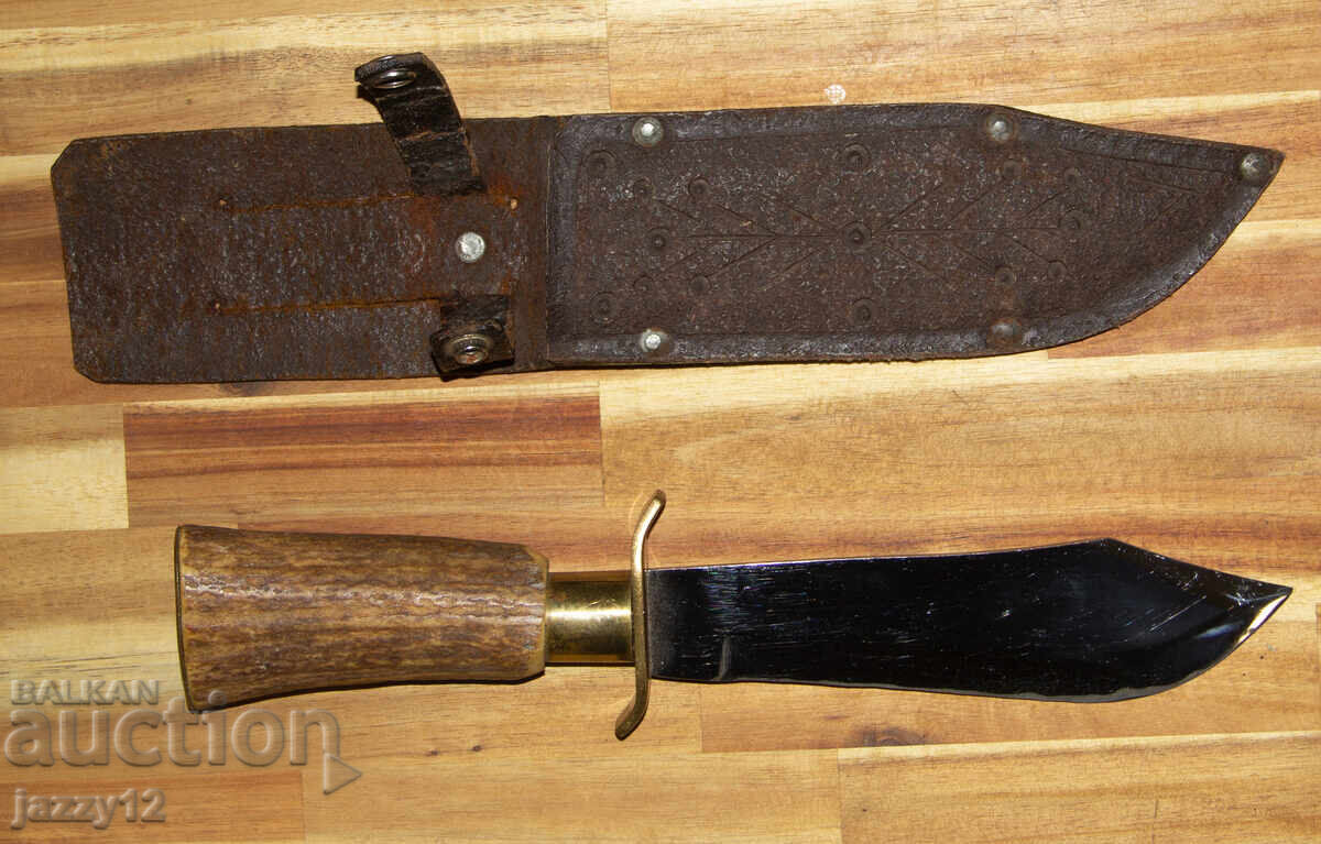Solid hunting knife with a horn handle