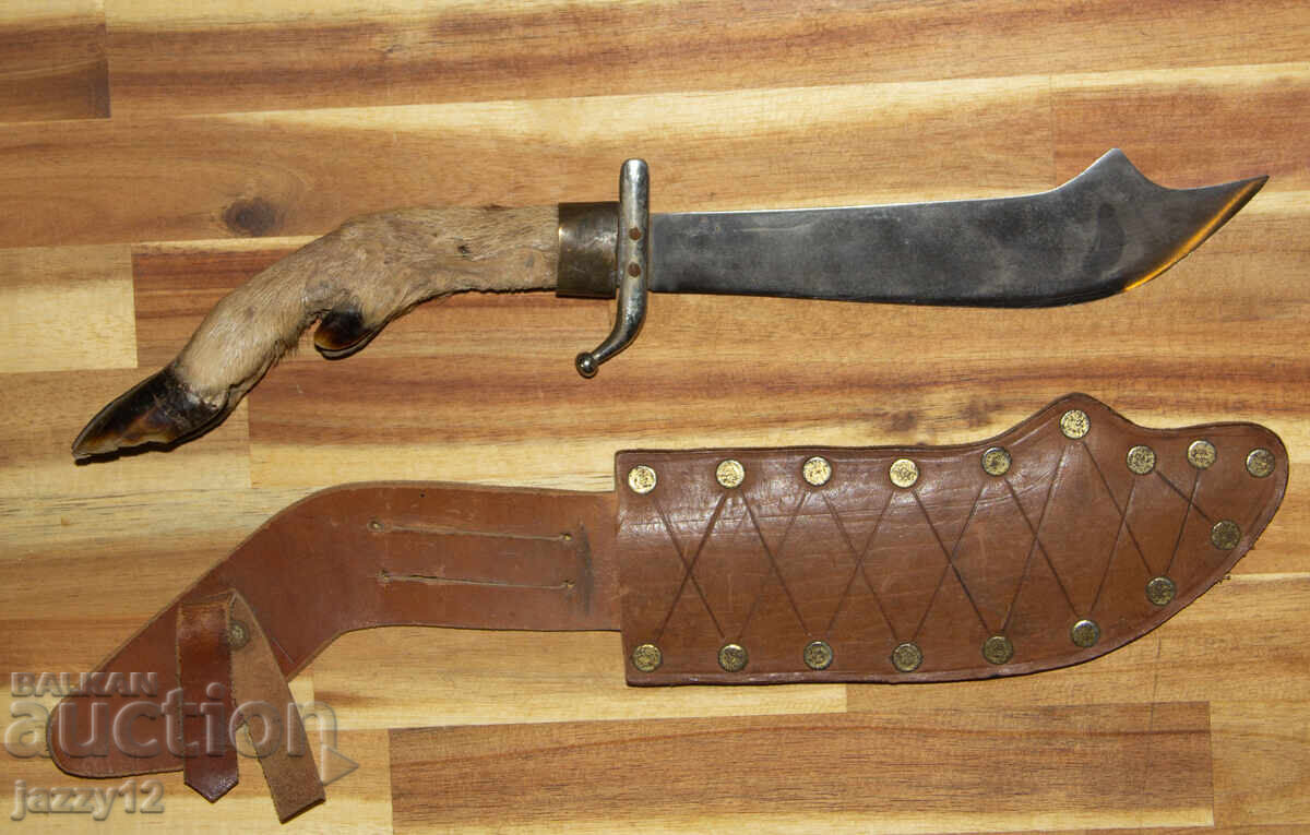 Solid hunting knife with a hoof handle