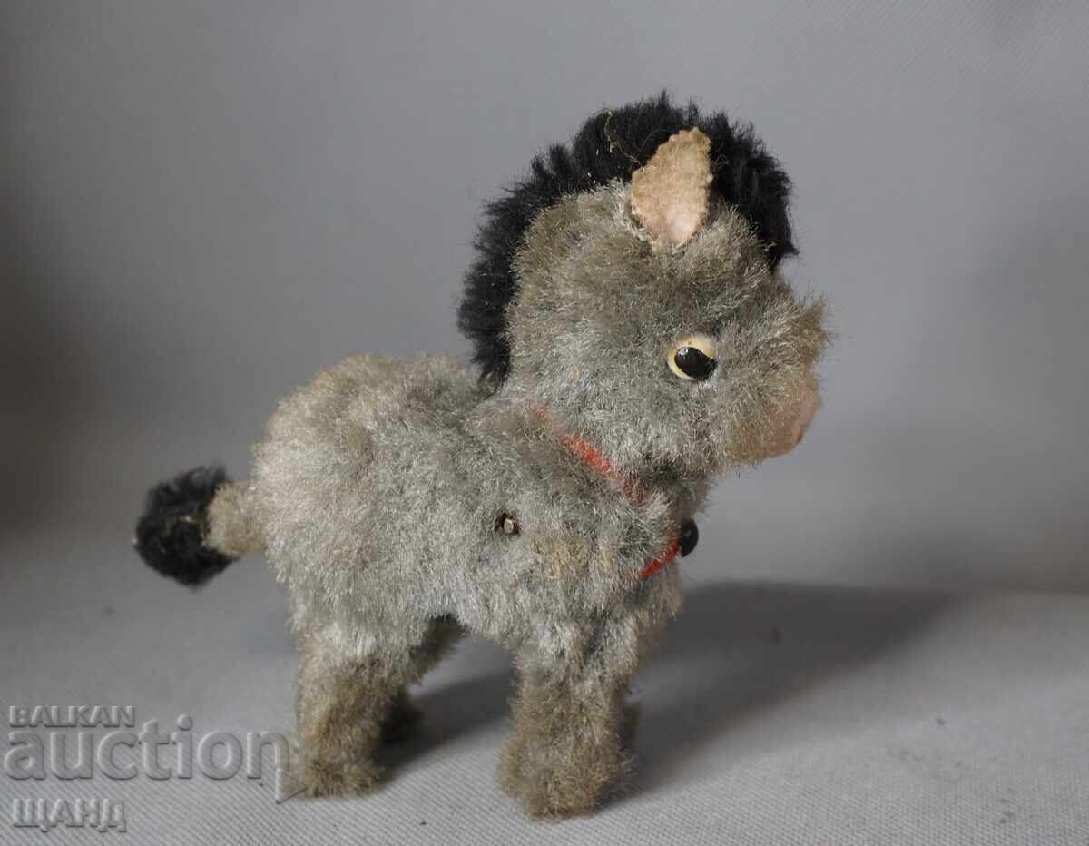 Παλιά μηχανική φιγούρα παιχνιδιού γαϊδουράκι