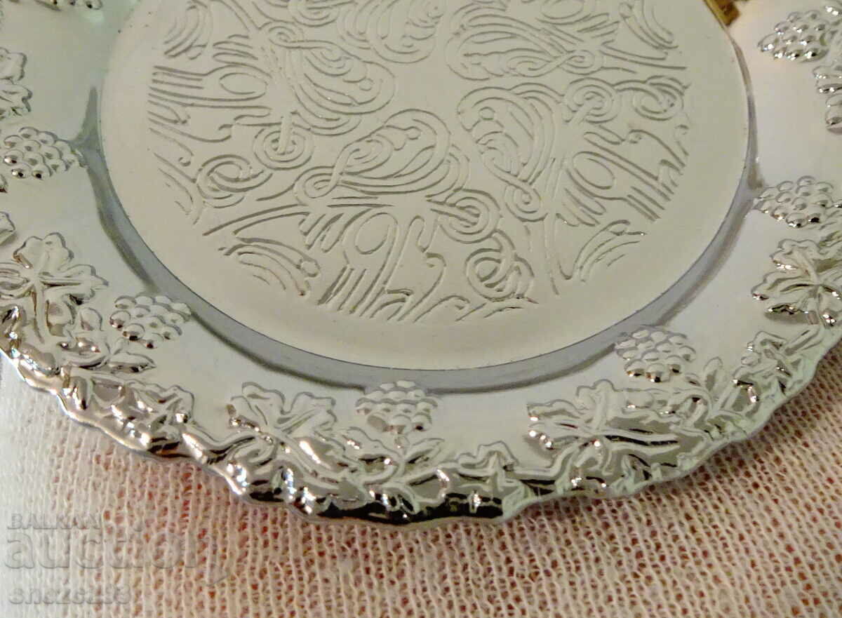 Auction  Silver-plated plate, embossed grapes.