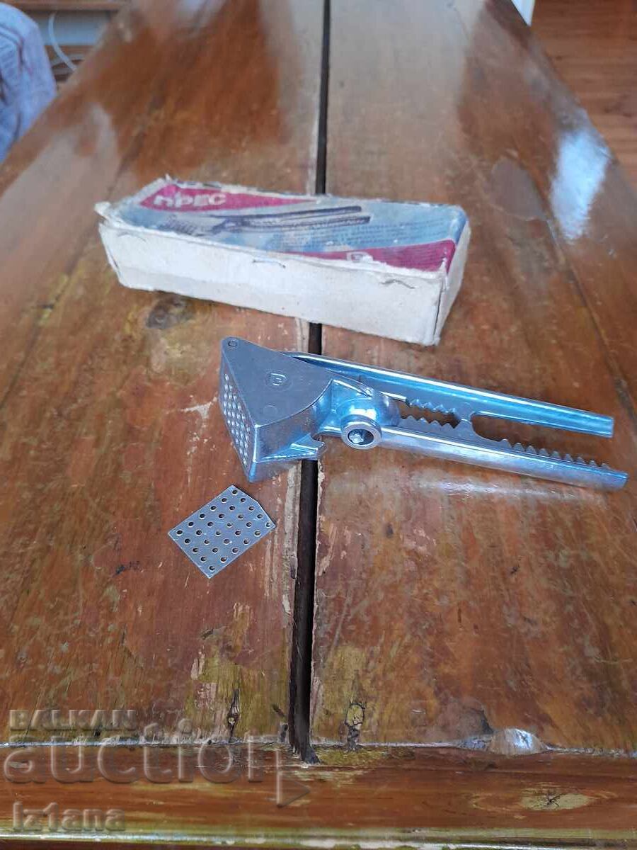 Auction  Old aluminum garlic press