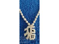 Necklace with ivory pendant, weight 22.93 g