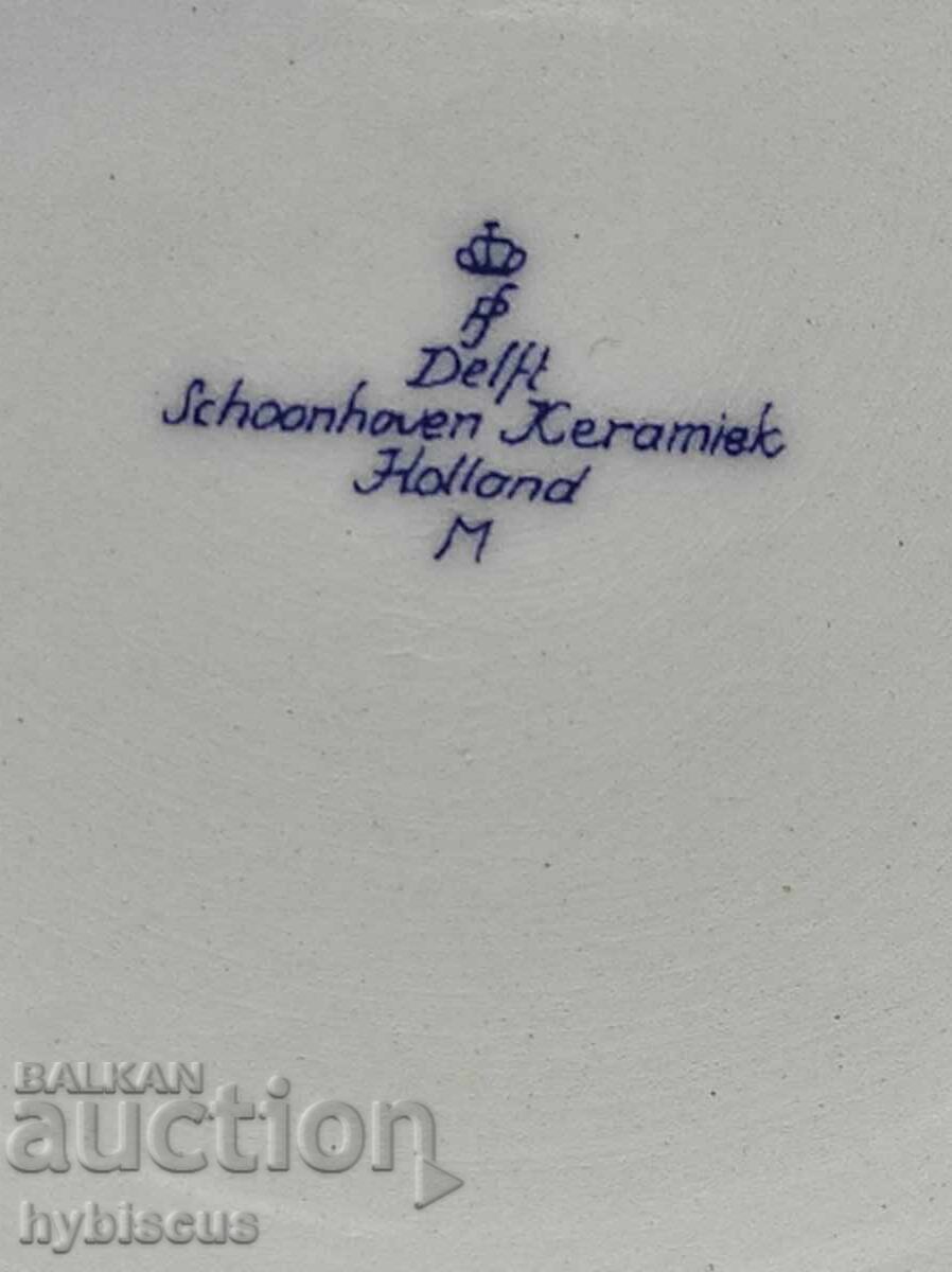 Auction  Flower basket on a Dutch Delft blue dinner plate