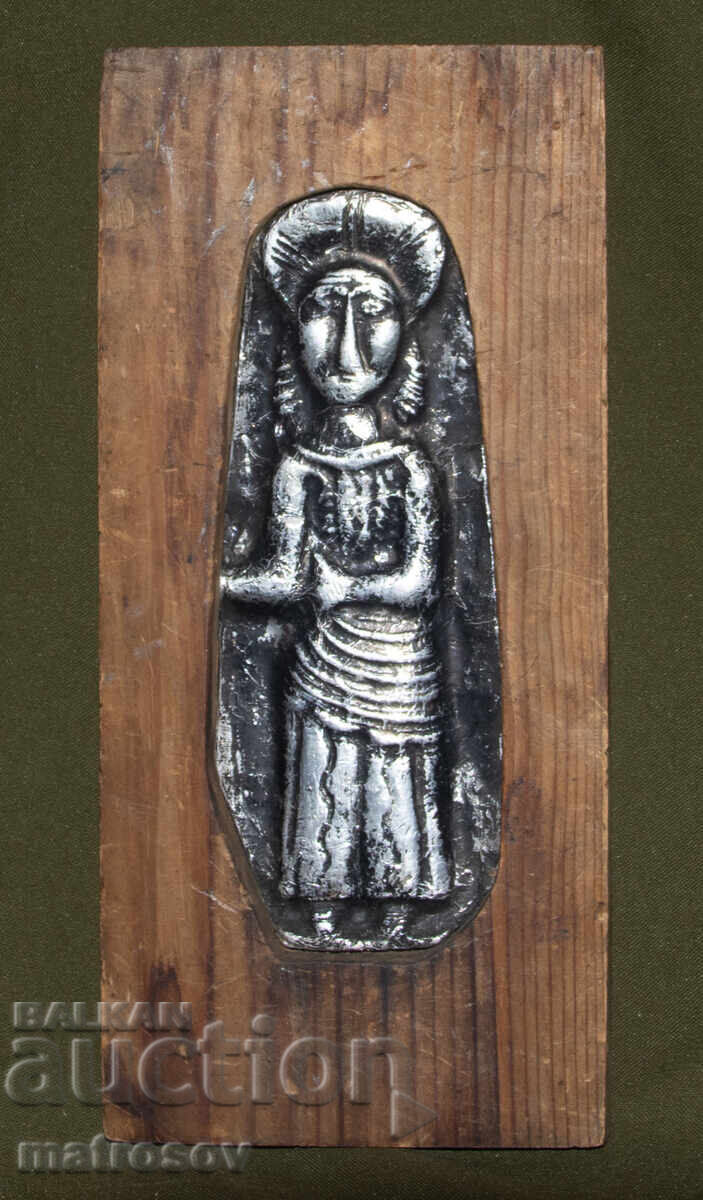 Metal plaque on wood, bas-relief, religious figure Metal plaque on wood, bas-relief, religious figure