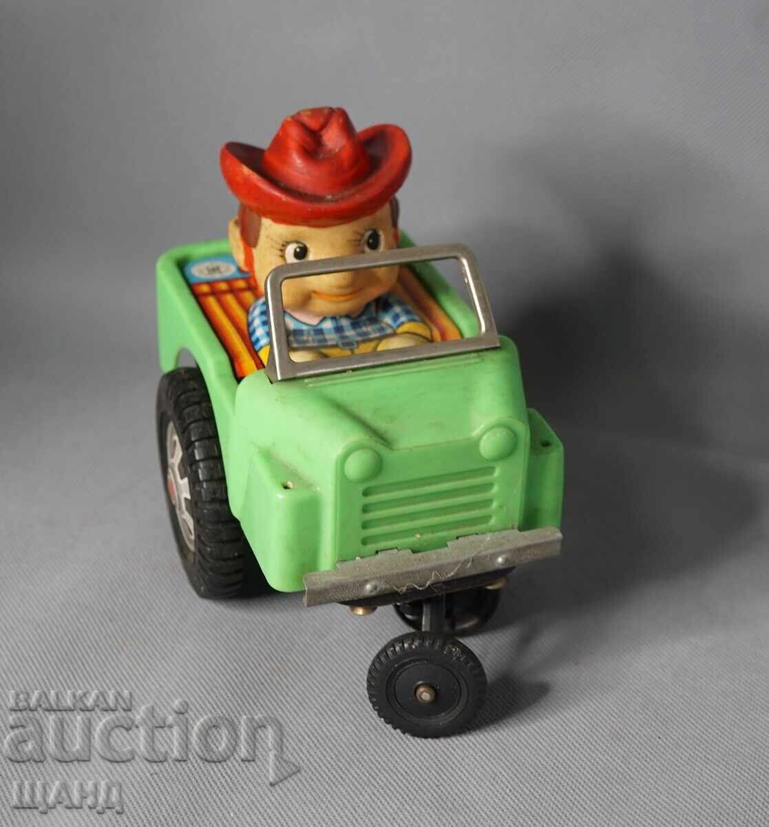 Παλιό Ιαπωνικό μεταλλικό μηχανικό παιχνίδι μοντέλο αυτοκινήτου καουμπόη με τιμή 20.35 BGN | € 10.40