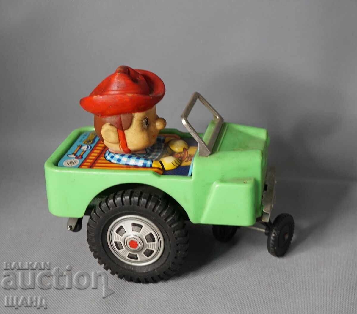 Παλιό Ιαπωνικό μεταλλικό μηχανικό παιχνίδι μοντέλο αυτοκινήτου καουμπόη