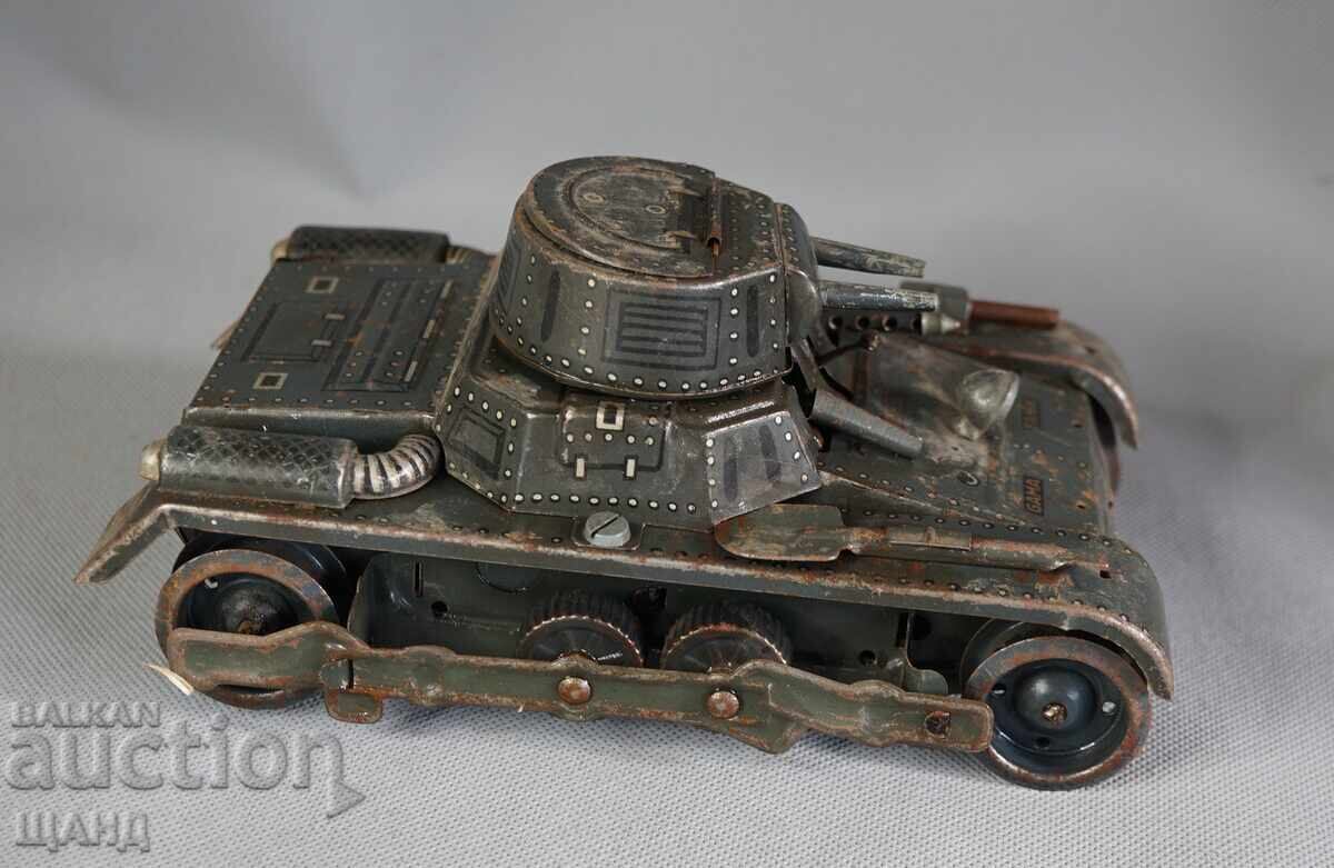 Auction Old German metal mechanical toy tank model Auction Old German metal mechanical toy tank model
