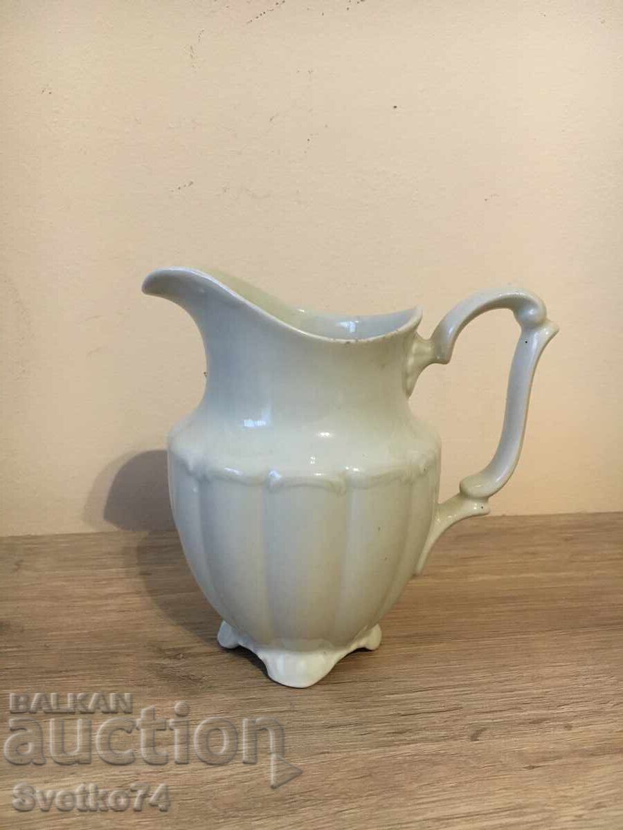 Porcelain milk jug with markings