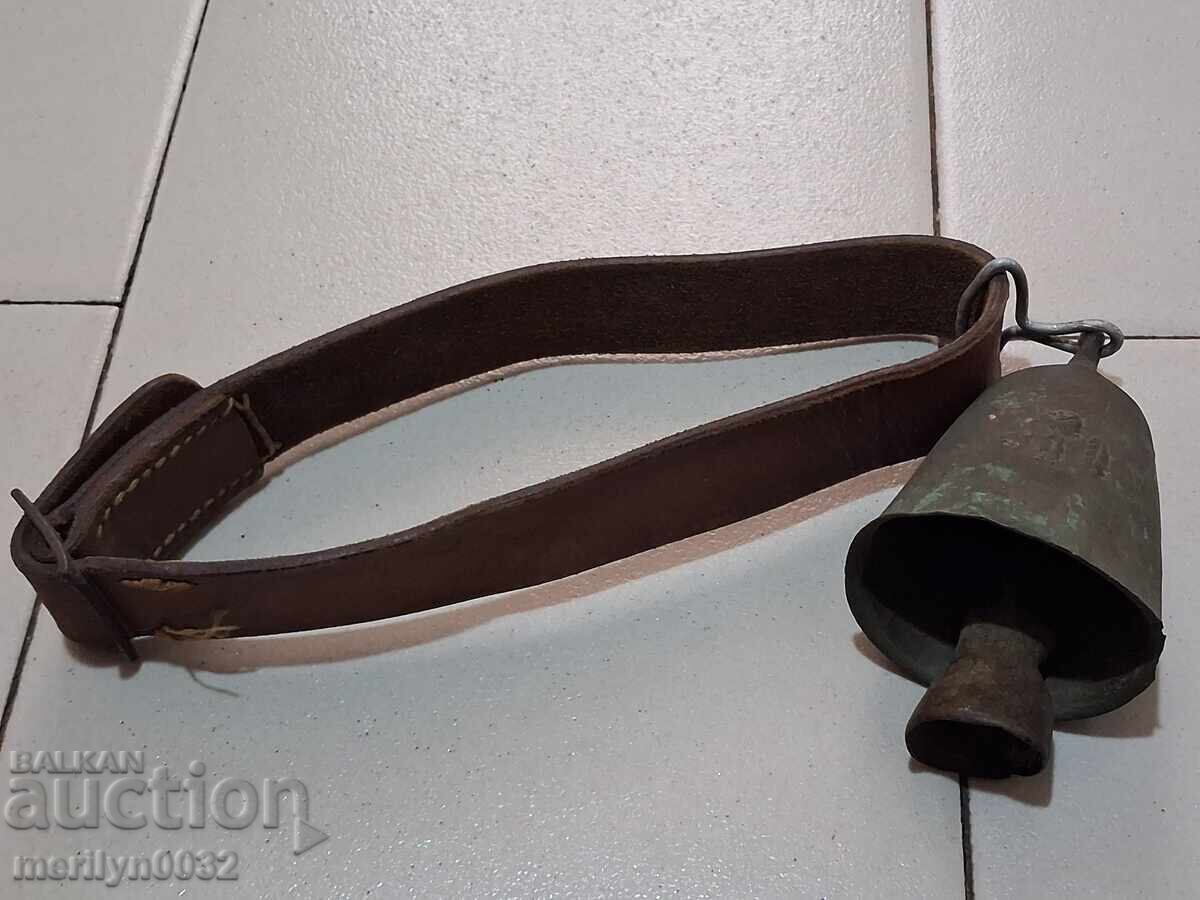 Old bronze cauldron with leather strap, bell, clapper, chime