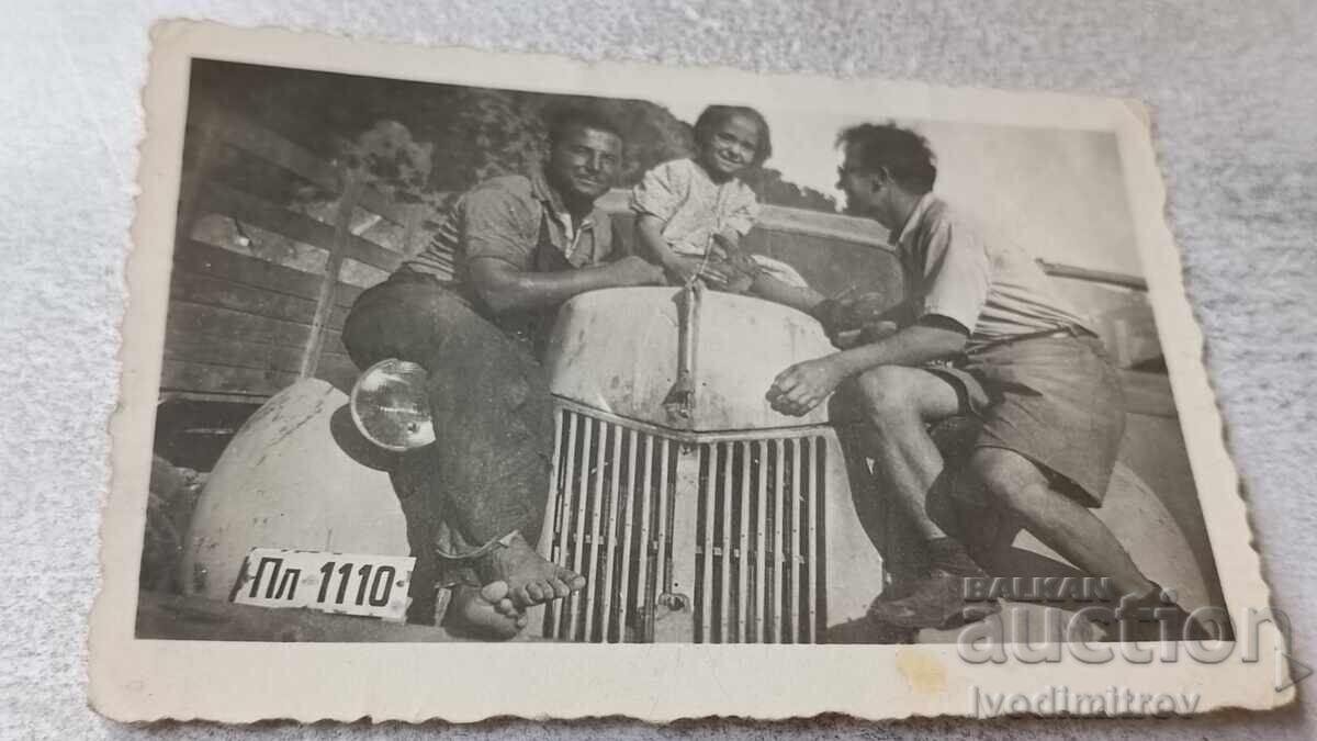 C-car, Two men and a girl with a retro car with license plate Pl 1110