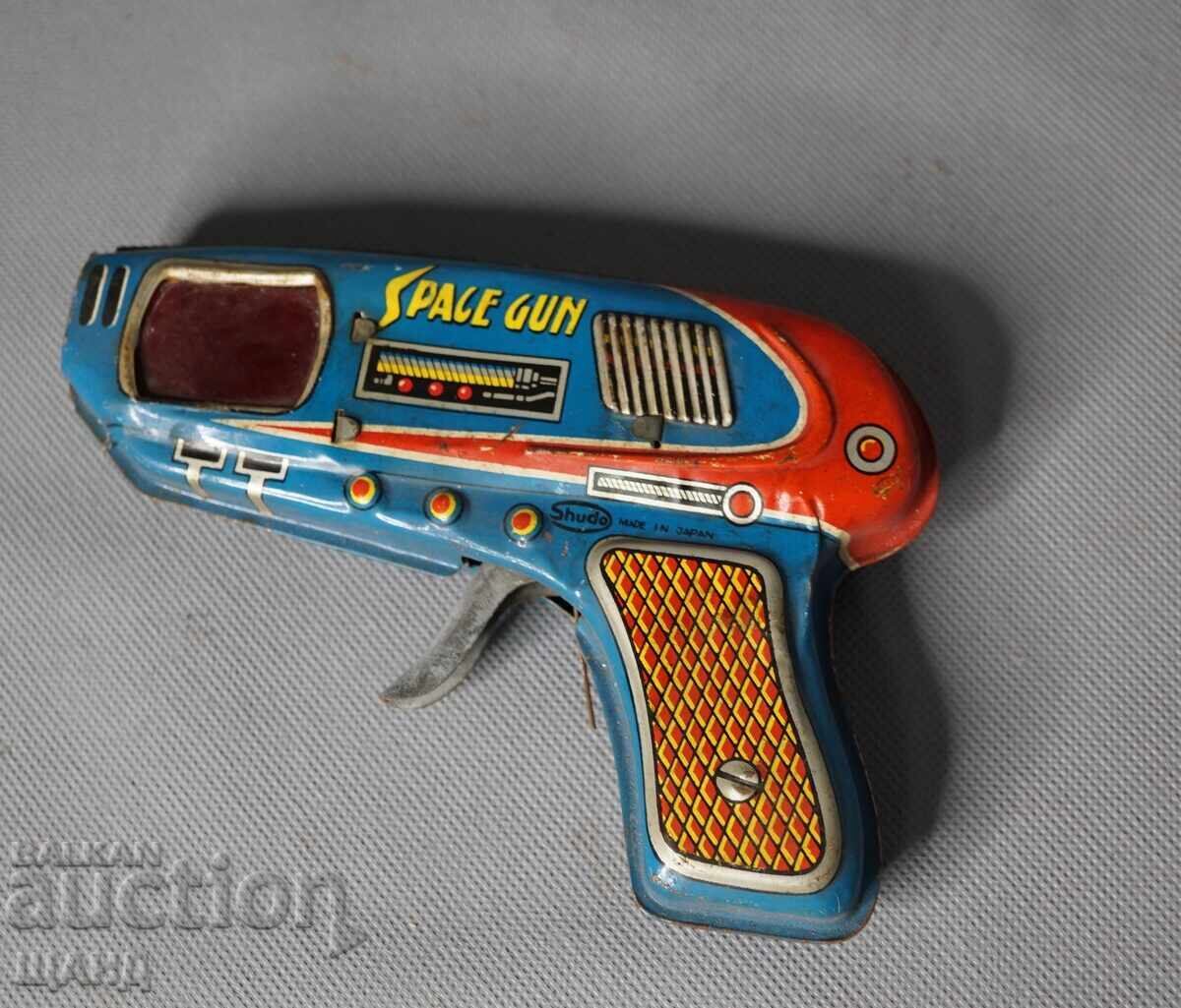 Vechiă jucărie mecanică metalică japoneză, pistol spațial Vechiă jucărie mecanică metalică japoneză, pistol spațial