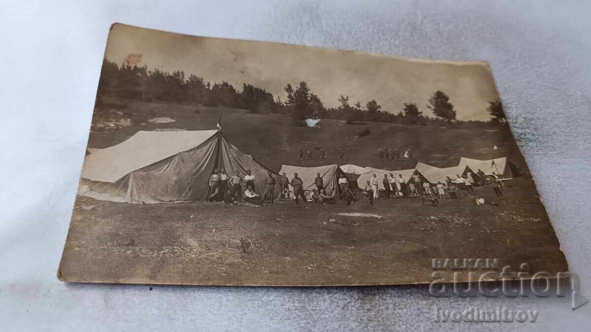 Photo Officers and soldiers in front of a tent camp