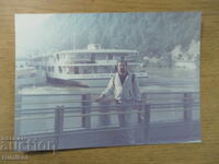 Old photo of a man with the ship "Sofia"