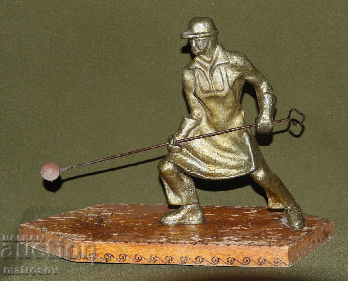 Handmade metal statuette, worker