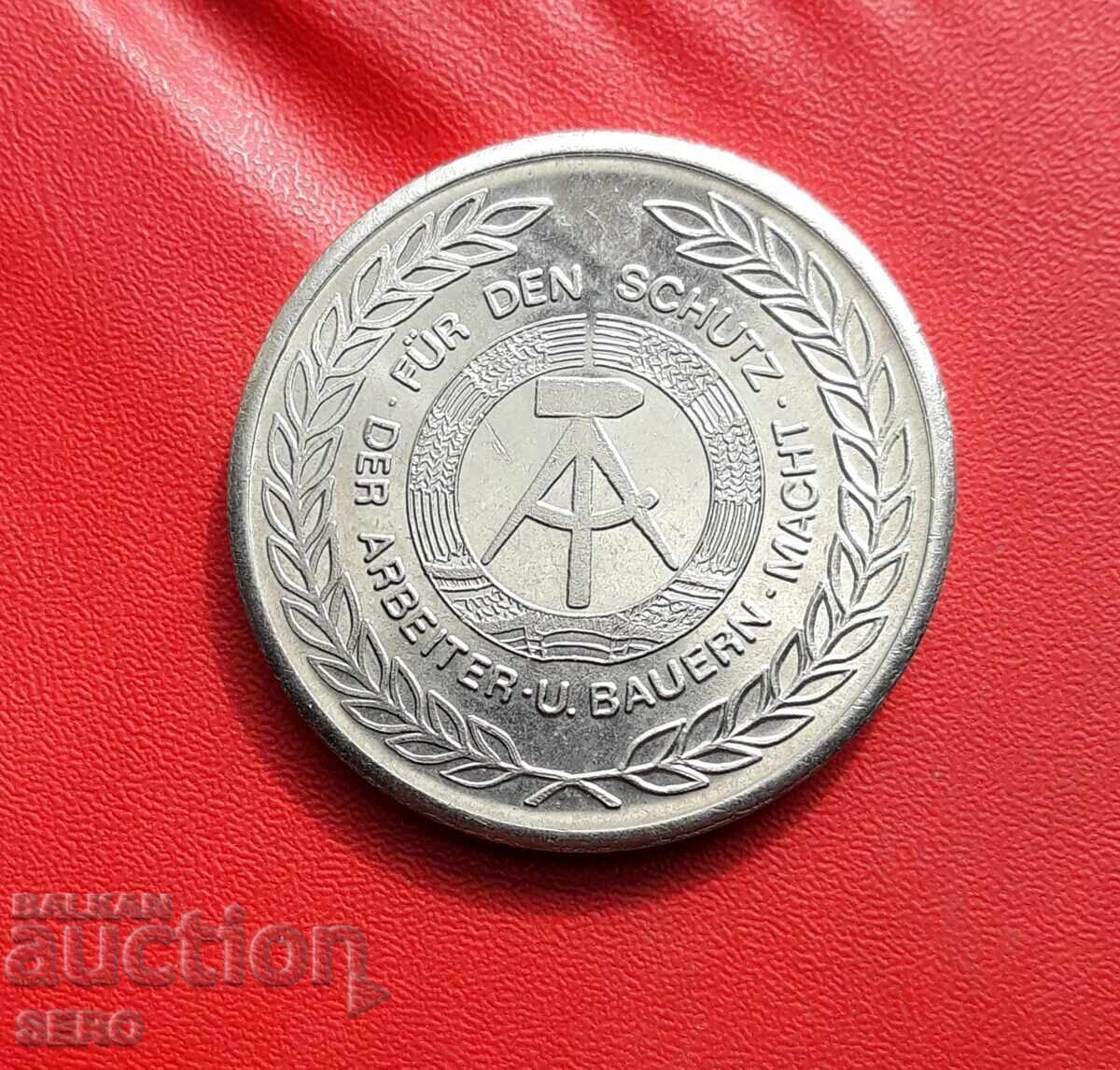 Μετάλλιο-Γερμανία-ΓΔΡ-μετάλλιο για απόφοιτο στρατιωτικής σχολής με τιμή 1.00 BGN | € 0.51