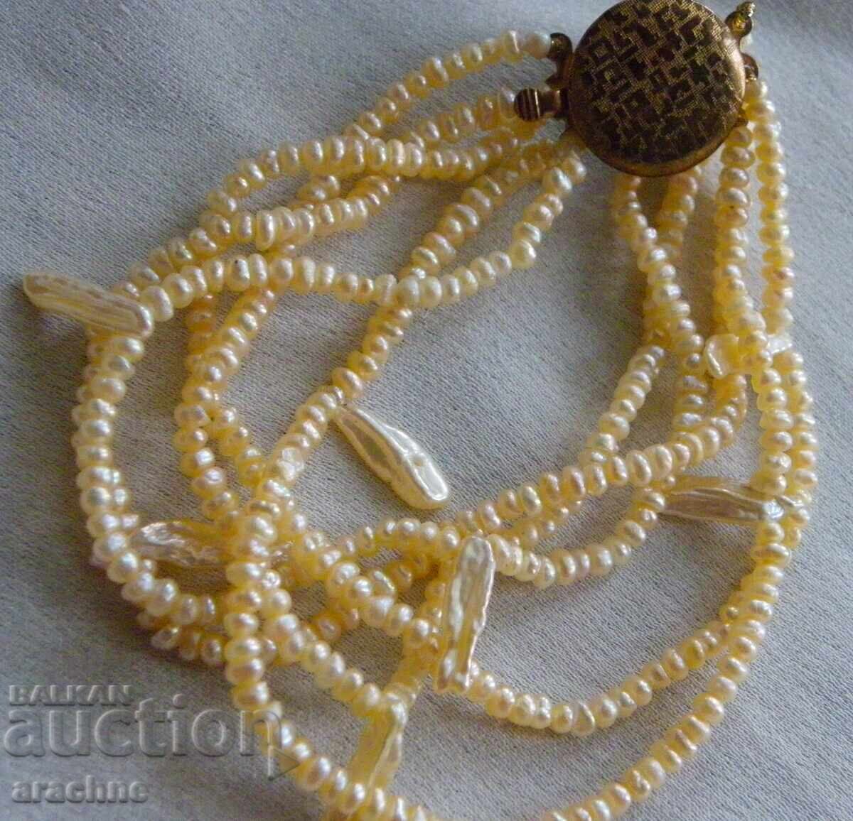 Δημοπρασία Γριβνά από φυσικά μαργαριτάρια Δημοπρασία Γριβνά από φυσικά μαργαριτάρια