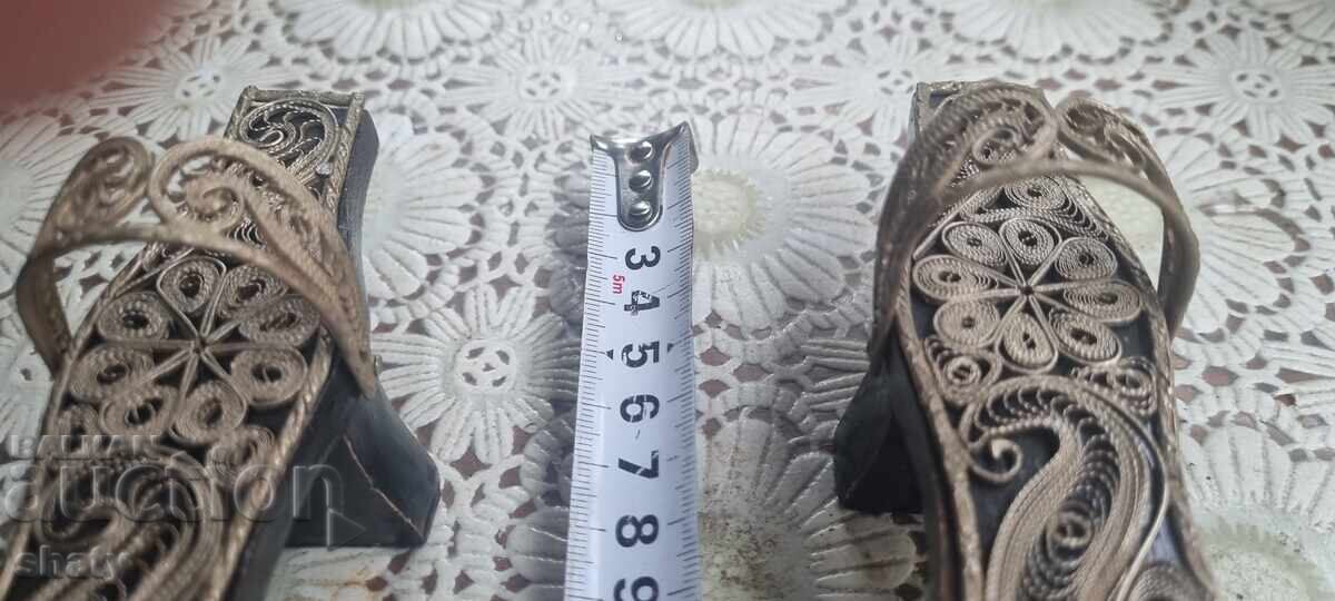 Delivery of Old ritual filigree clogs