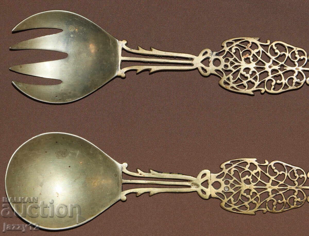 Auction  Old brass serving utensils
