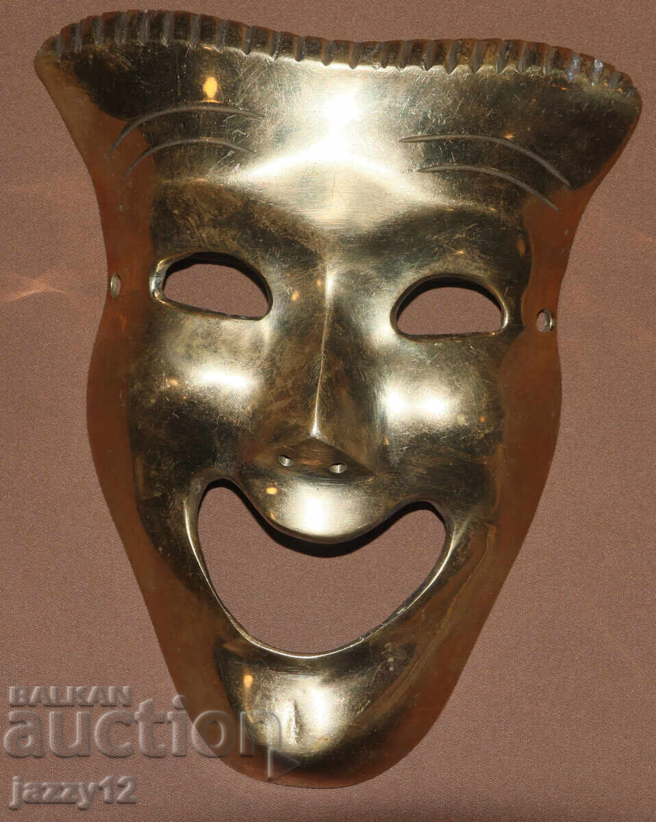 Auction  Solid brass theatrical mask