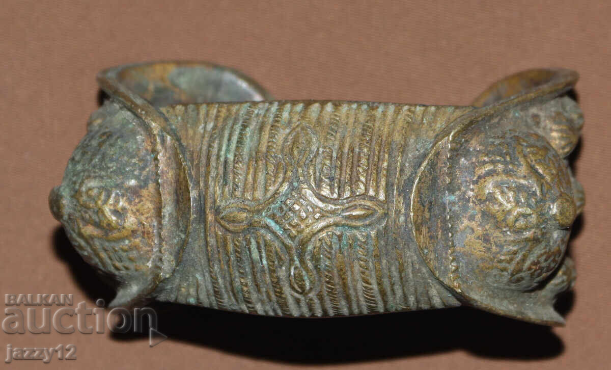 Old bronze bracelet slingshot with cross