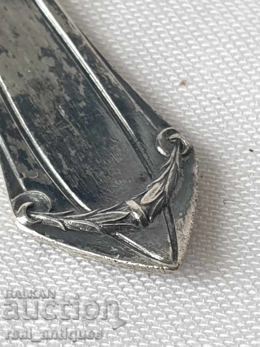 Auction  A silver spoon