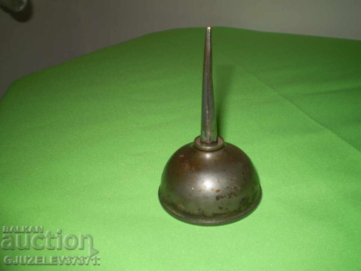 Vintage steel oil can with thumb pump for small machines