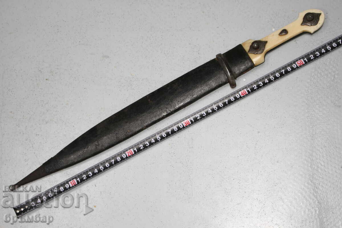 Russian Caucasian dagger with silver ornaments on the hilt Russian Caucasian dagger with silver ornaments on the hilt