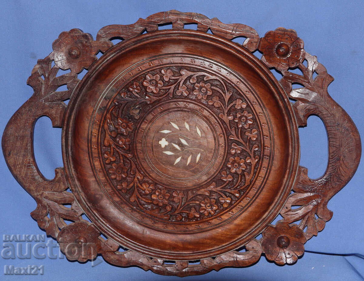 Decorative hand-carved wooden tray