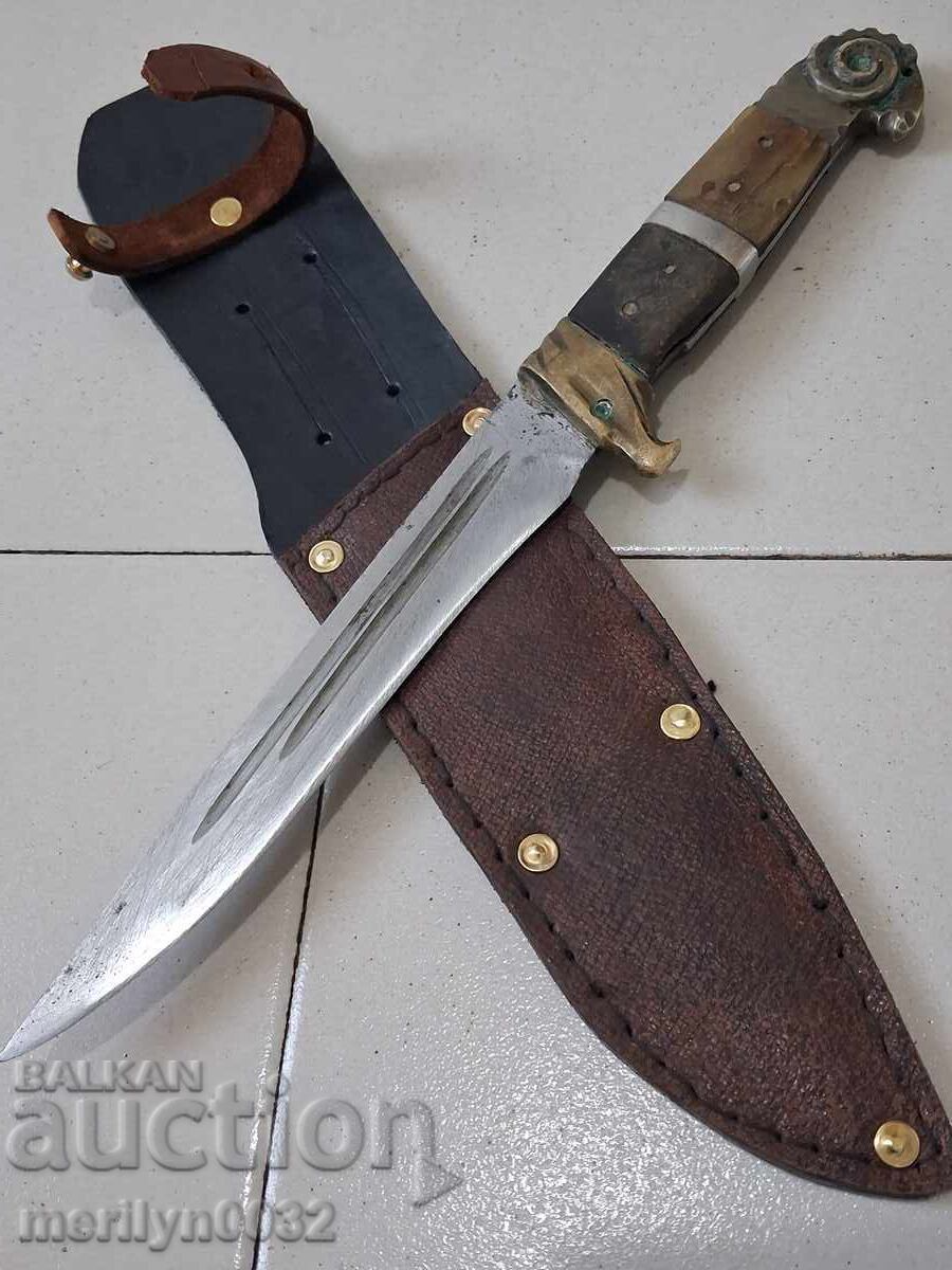 Old hunting knife with a leather sheath and a buffalo horn handle