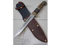 Old hunting knife with a leather sheath and a buffalo horn handle