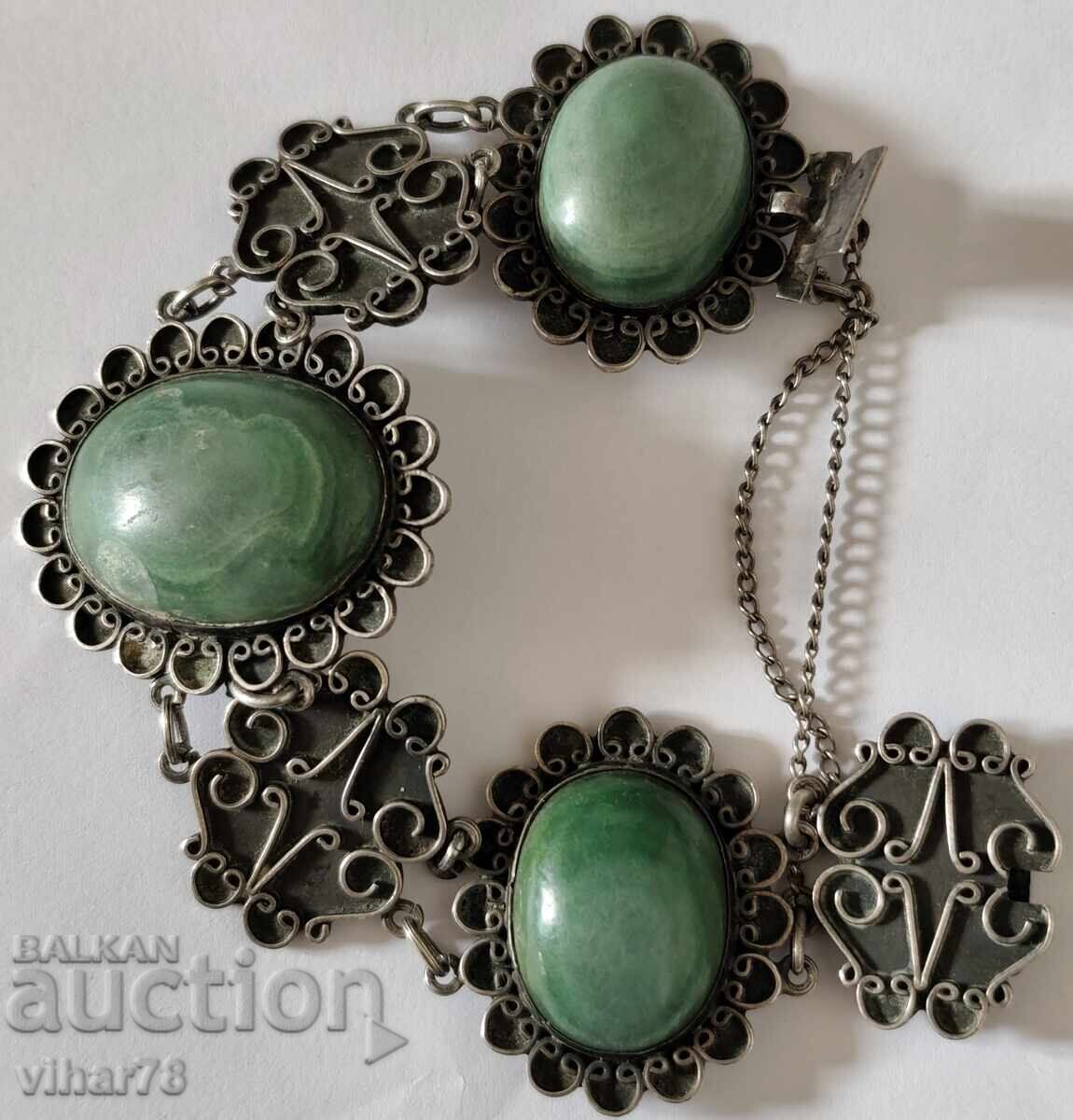 Delivery of Silver bracelet with three large green stones
