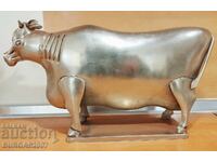Old metal figure, cow