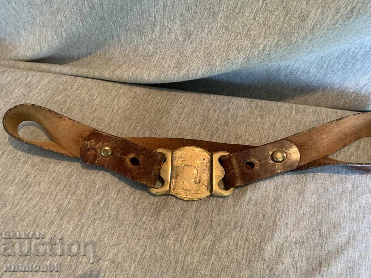 Delivery of Old leather belt with brass buckle and decorations