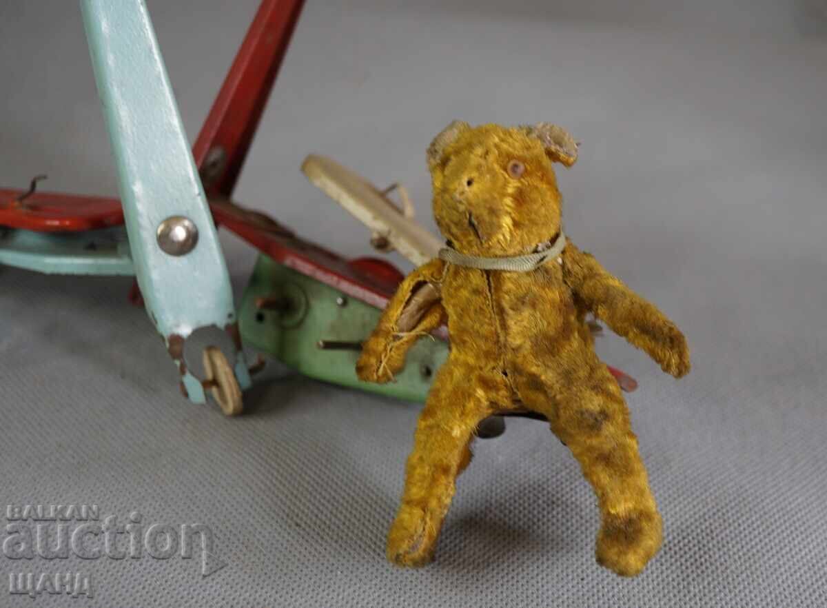 Old mechanical metal toy scooter model with bear with price 15.35 BGN | € 7.85 Old mechanical metal toy scooter model with bear with price 15.35 BGN | € 7.85