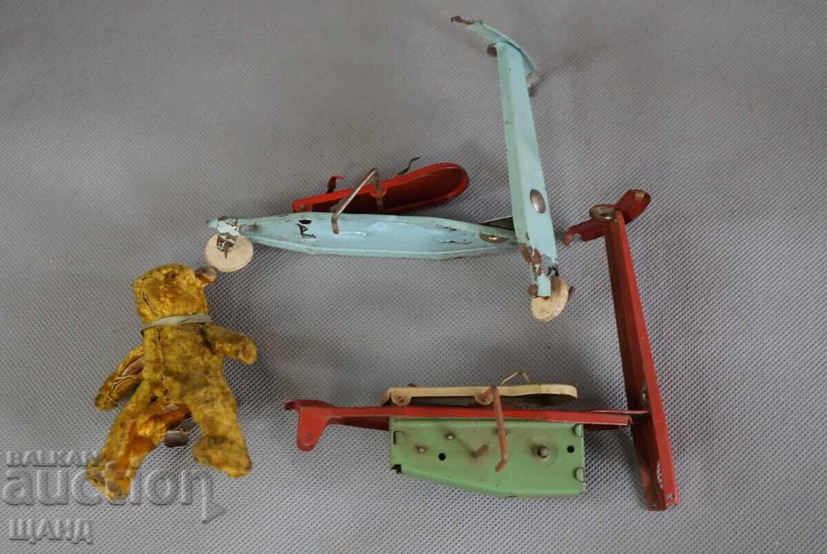 Delivery of Old mechanical metal toy scooter model with bear Delivery of Old mechanical metal toy scooter model with bear
