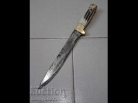 Hunting knife without a sheath with deer antler scales