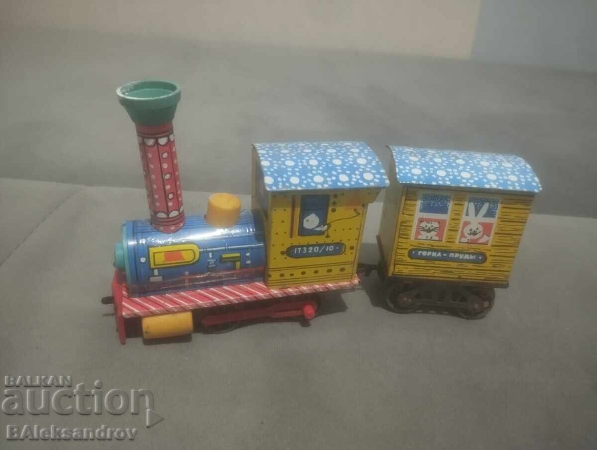 Jucărie veche mecanică din tablă