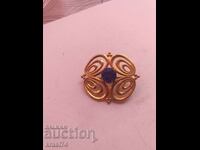 Gilded brooch