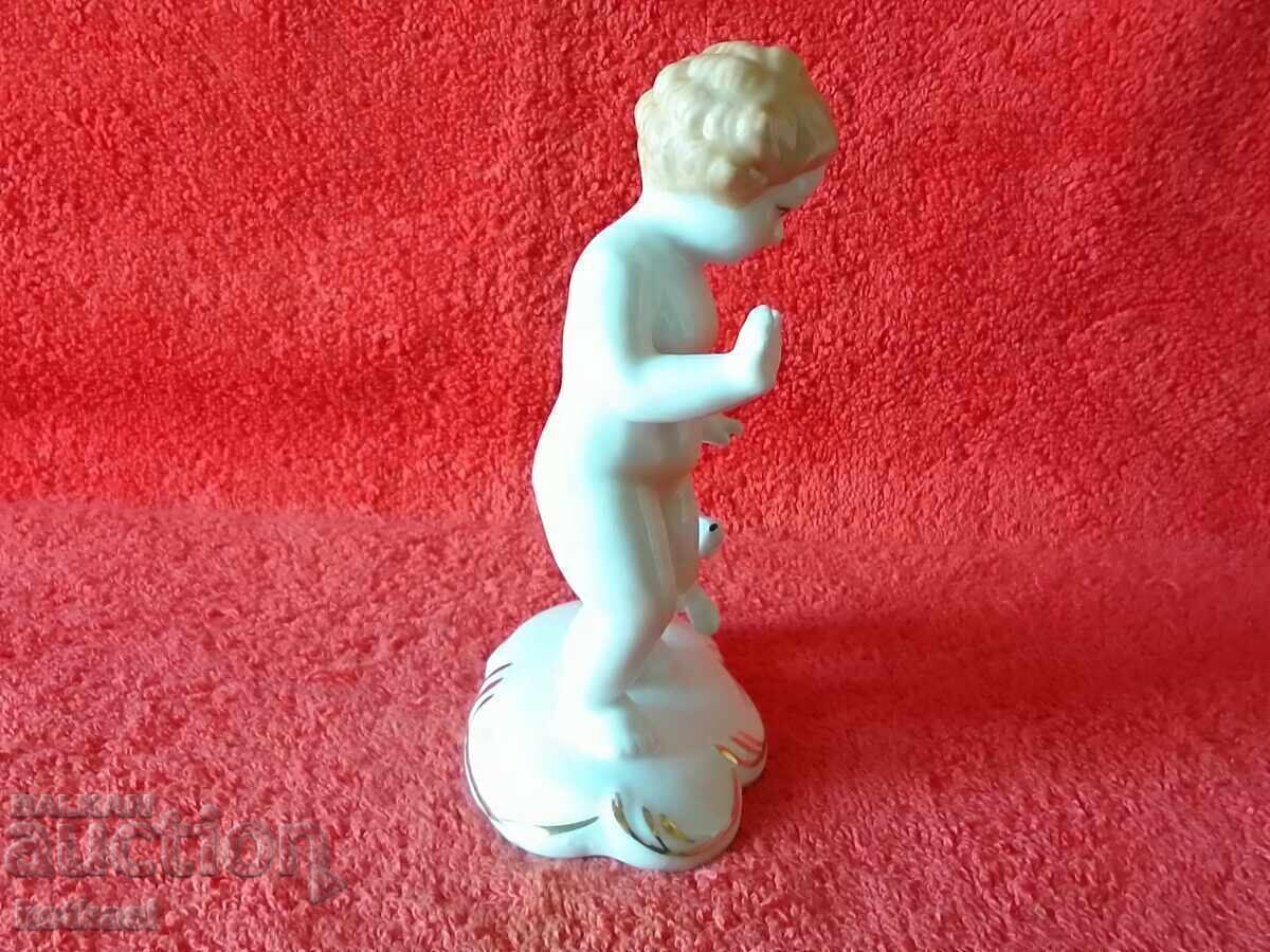 Auction  Old porcelain figure of a child, boy playing with a dog